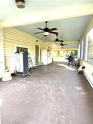 a view of a backyard with plants and a patio