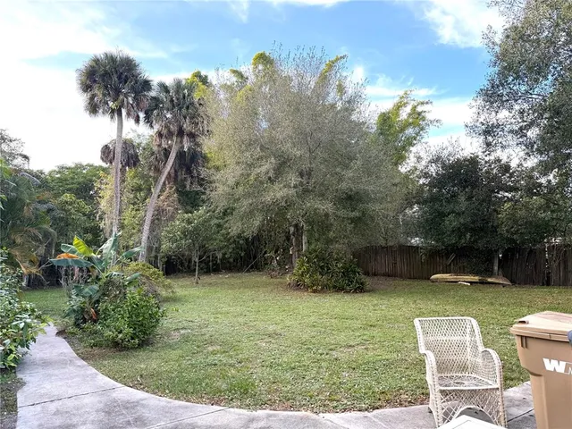 a view of a outdoor space with a garden and entertaining space