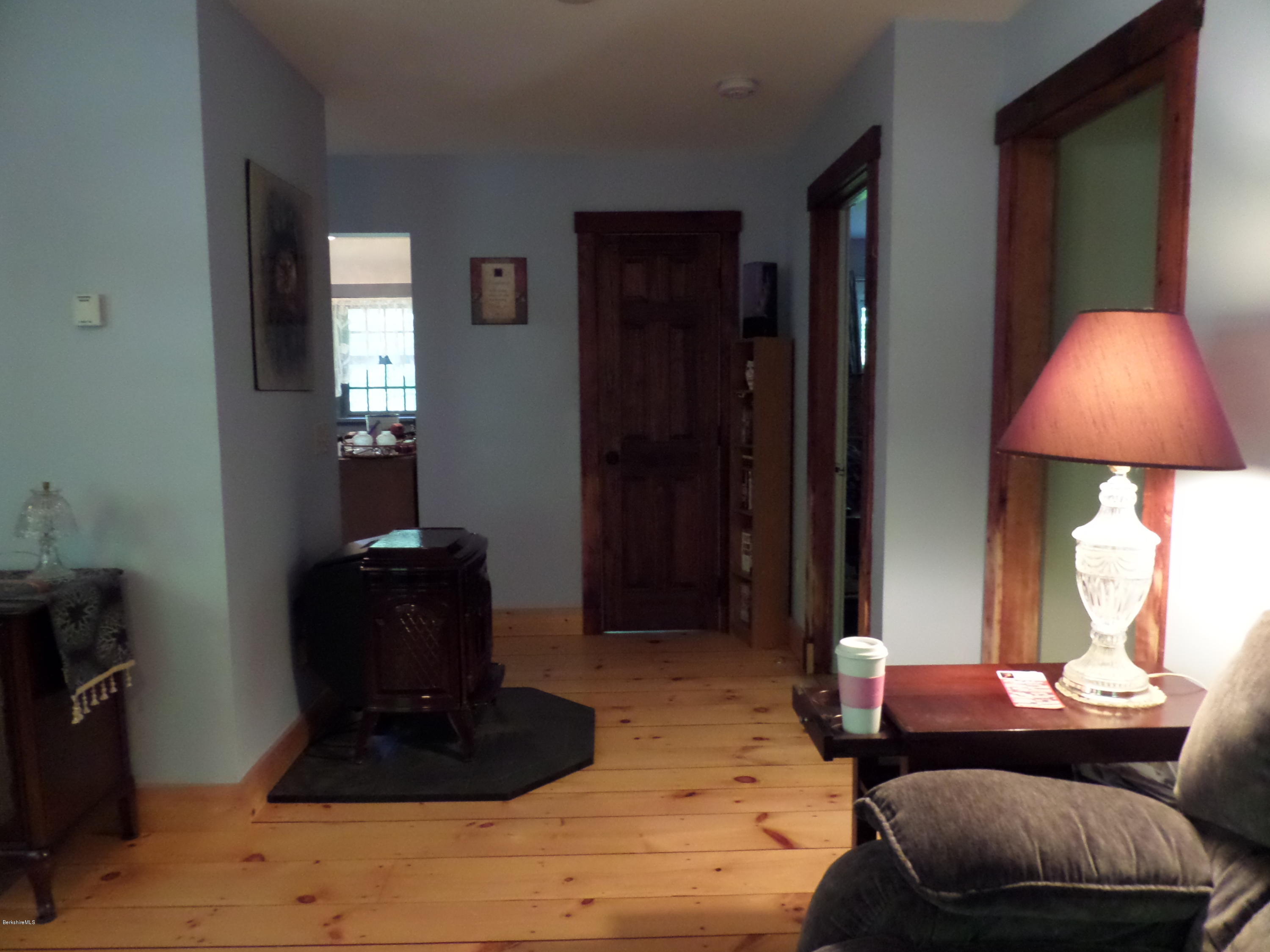 800 Sportsman Road Stamford, VT 05352 - Photo 17 of 26 a living room with furniture and a lamp