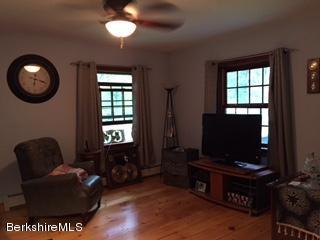 800 Sportsman Road Stamford, VT 05352 - Photo 24 of 26 a living room with furniture and a flat screen tv