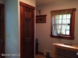 800 Sportsman Road Stamford, VT 05352 - Photo 26 of 26 a bathroom with a sink a mirror and next to a window