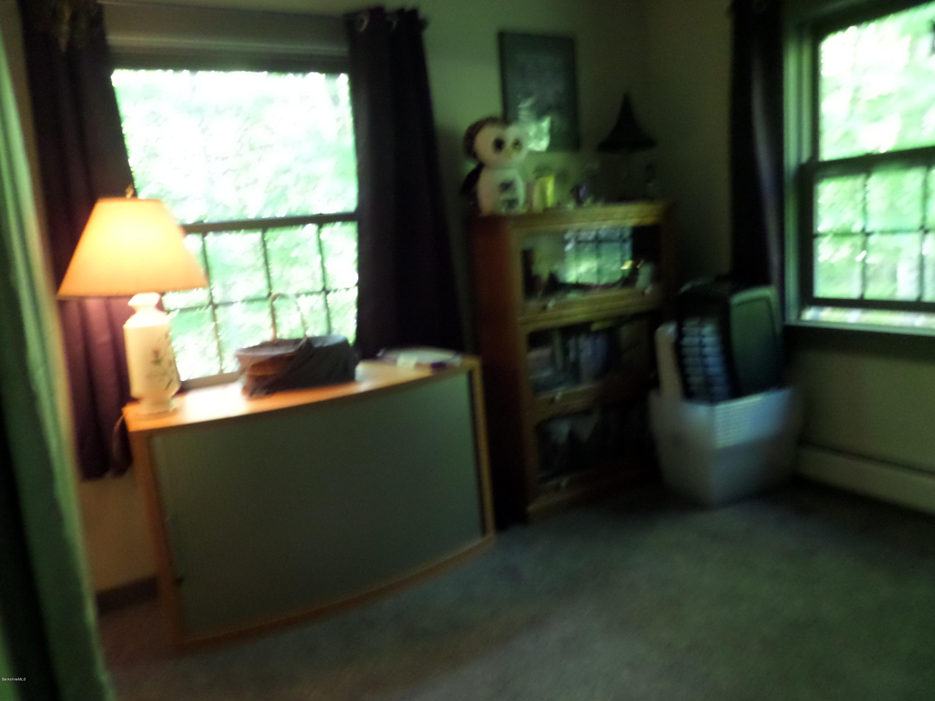800 Sportsman Road Stamford, VT 05352 - Photo 5 of 26 a room with window table and chairs