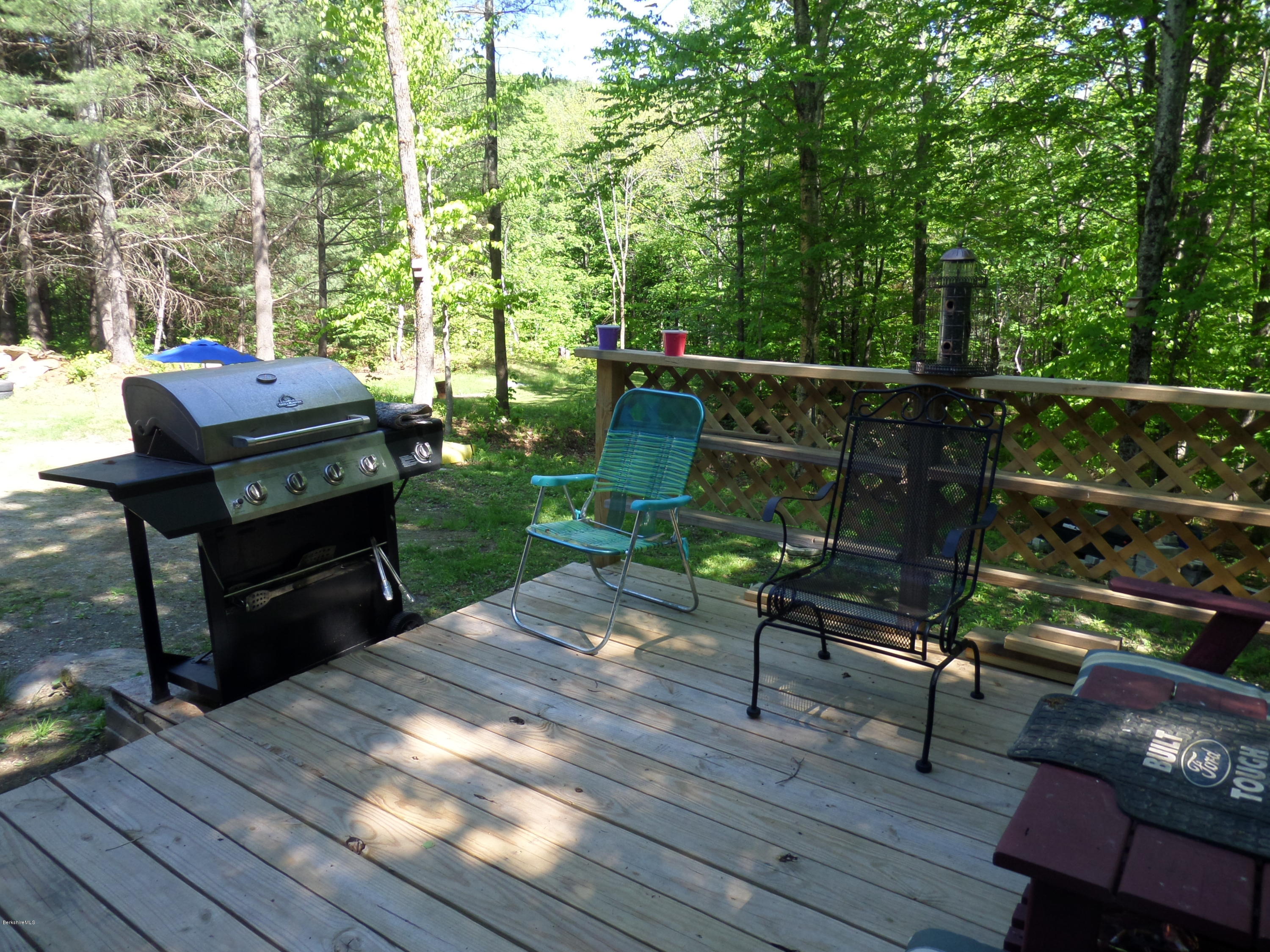 800 Sportsman Road Stamford, VT 05352 - Photo 7 of 26 a view of a deck with wooden floor and outdoor seating