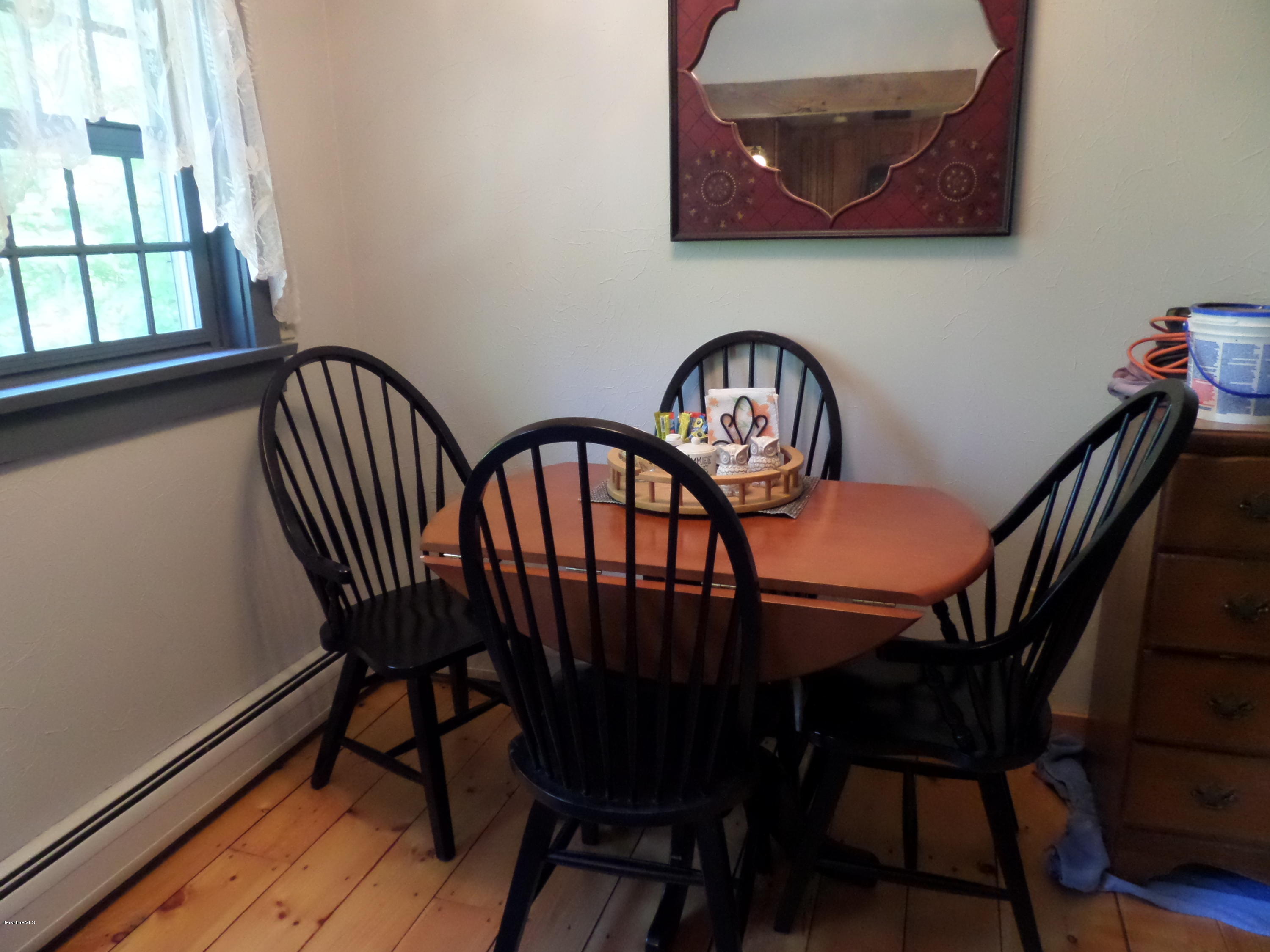 800 Sportsman Road Stamford, VT 05352 - Photo 8 of 26 a view of a dining room with furniture and window