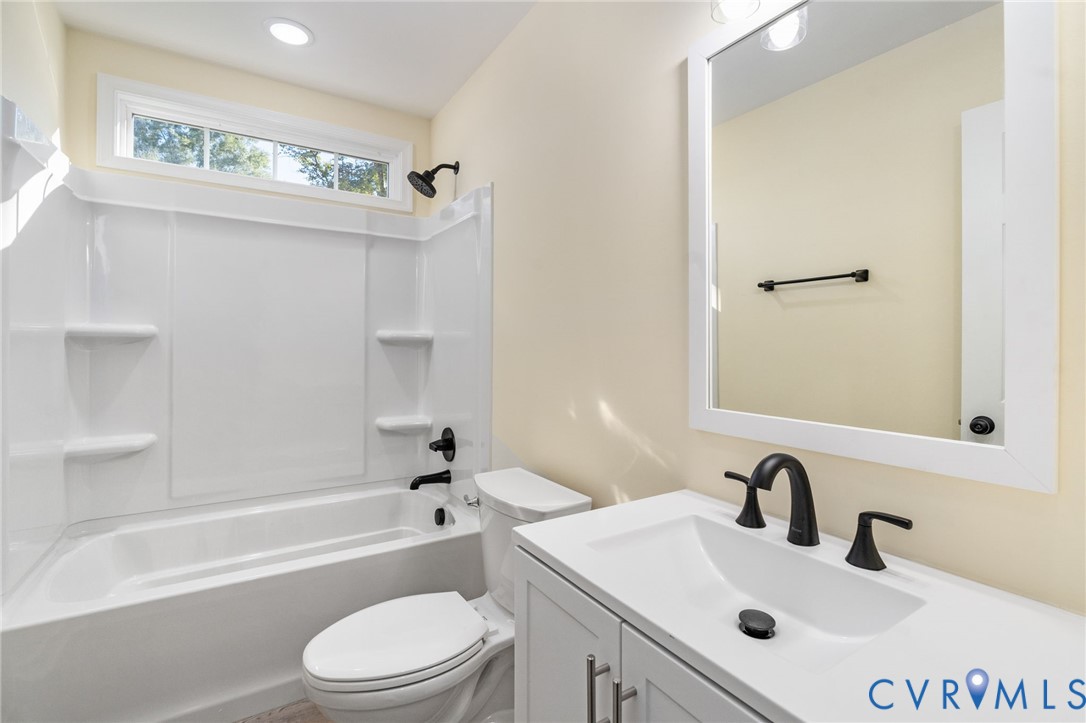 11206 South Crater Road Petersburg, VA 23805 - Photo 14 of 19 a bathroom with a sink toilet and shower