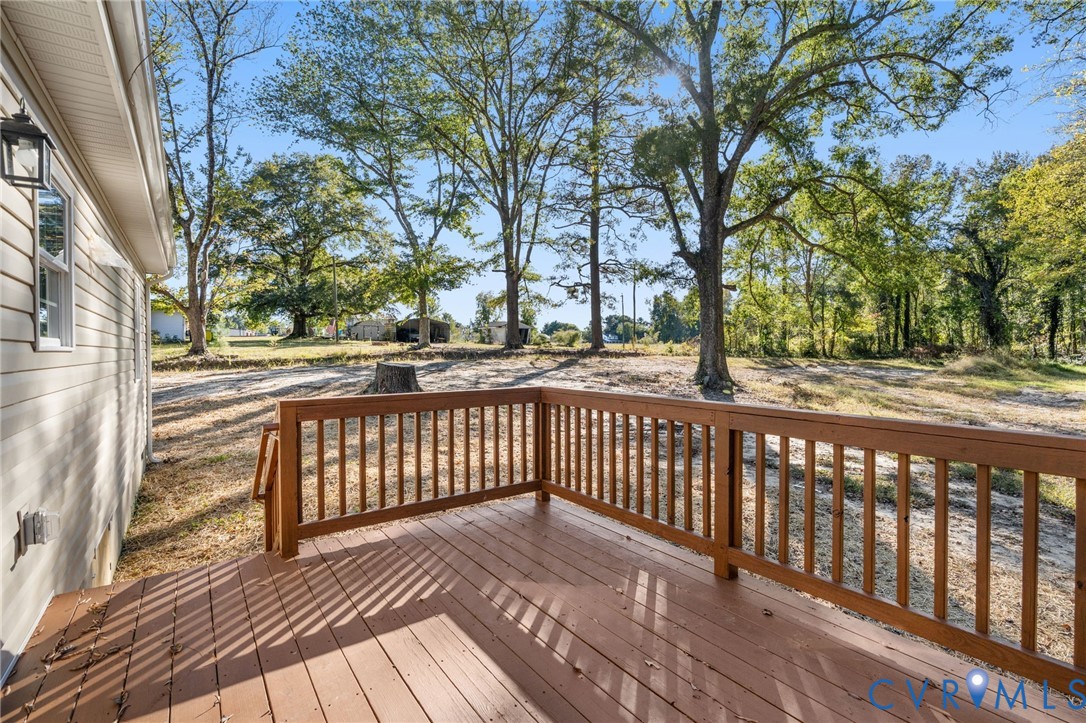 11206 South Crater Road Petersburg, VA 23805 - Photo 18 of 19 a view of a balcony with wooden floor and fence