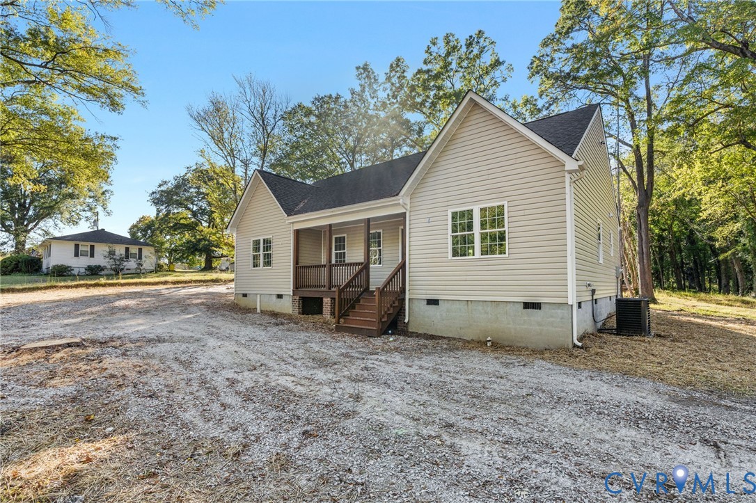11206 South Crater Road Petersburg, VA 23805 - Photo 2 of 19 a view of a house with a yard and covered with trees