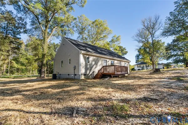 a view of a yard with a house and a tree