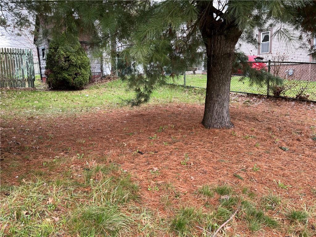 802 Wallis Avenue Farrell, PA 16121 - Photo 3 of 6 a view of a tree in the middle of a yard