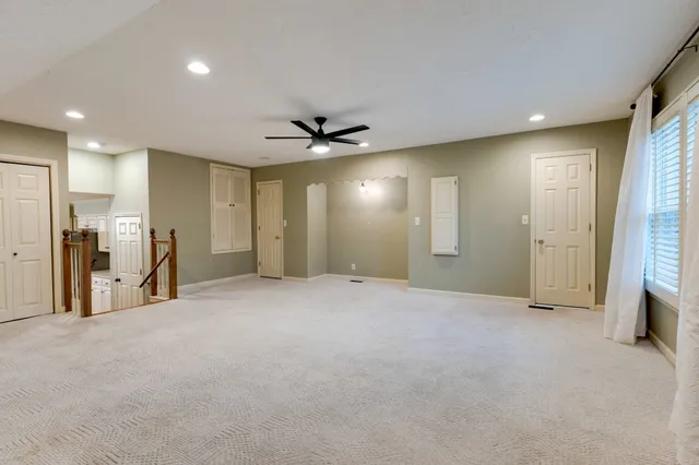 a view of a livingroom with a ceiling fan