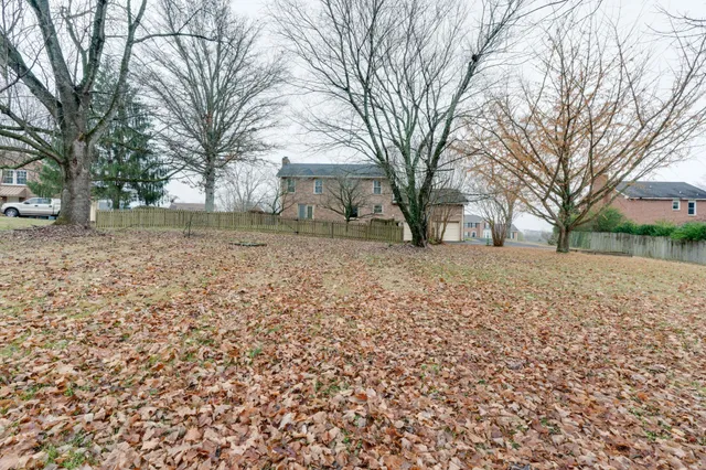 a pathway of a house with a yard covered in snow