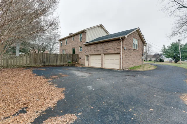 a view of a swimming pool with a yard