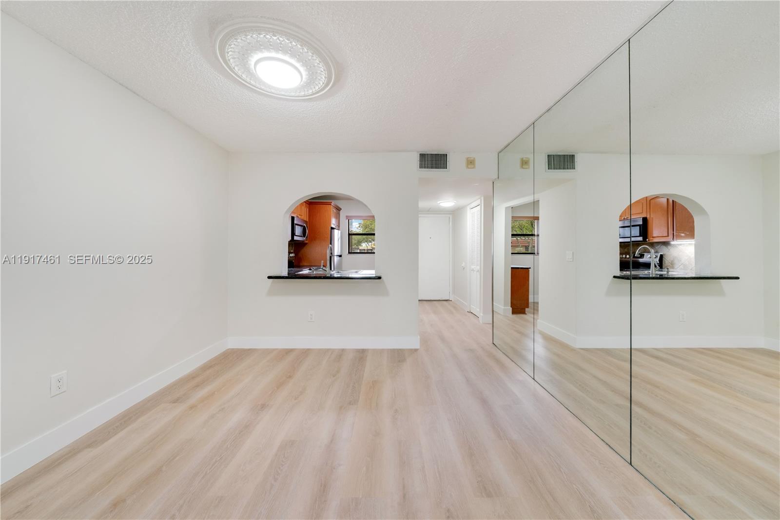 14847 Southwest 104th Street, Unit 10203 Miami, FL 33196 - Photo 12 of 22 a view of a room with wooden floor