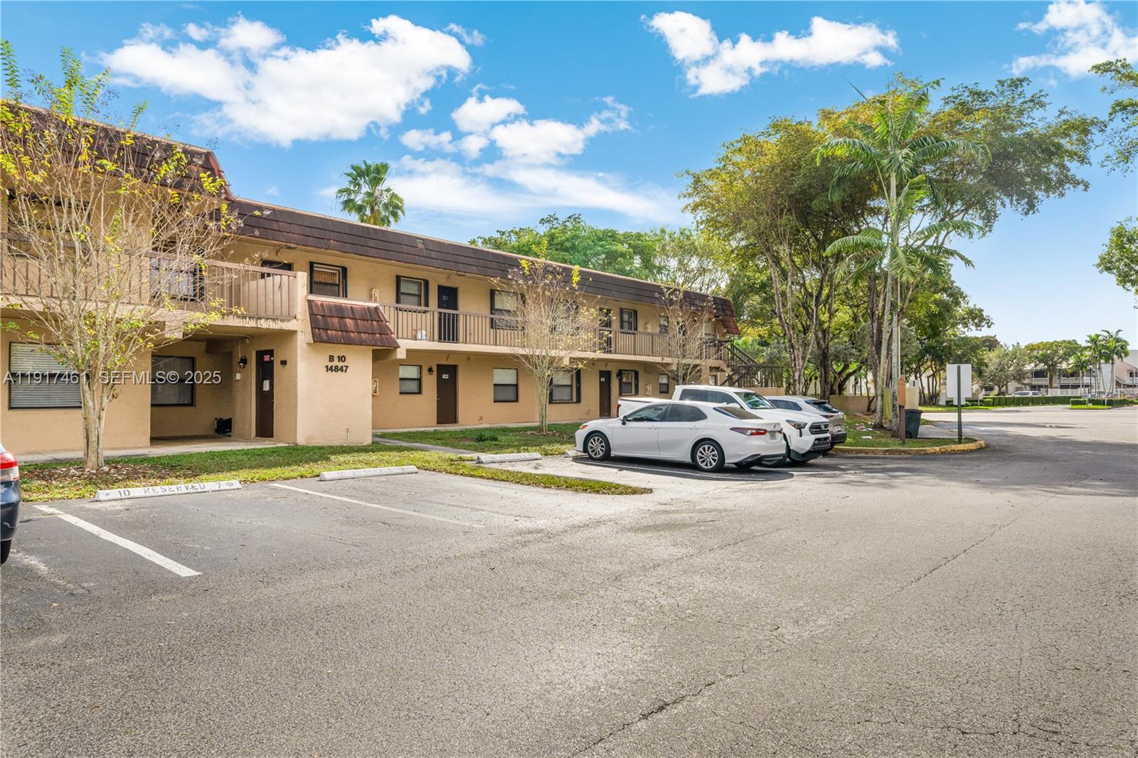 14847 Southwest 104th Street, Unit 10203 Miami, FL 33196 - Photo 21 of 22 a view of street with parked cars
