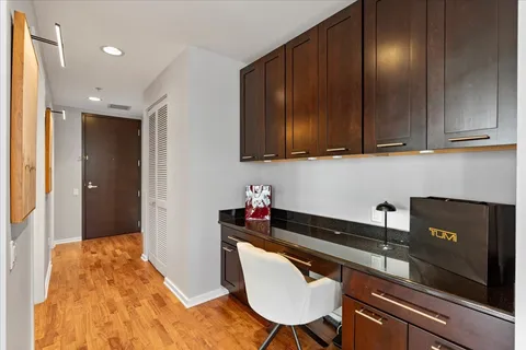 a kitchen with granite countertop cabinets table and chairs