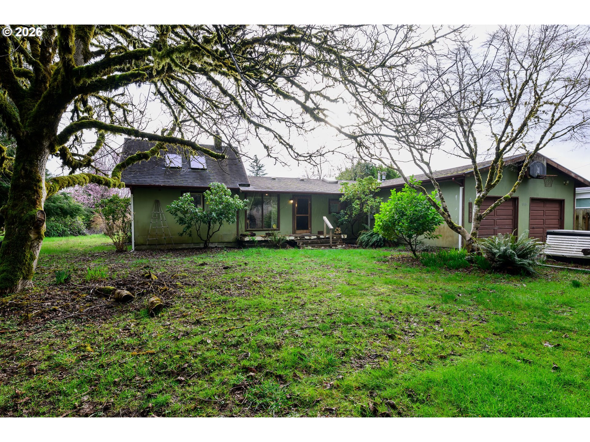 1377 Moonshine Park Road Logsden, OR 97357 - Photo 1 of 40 a front view of a house with a yard