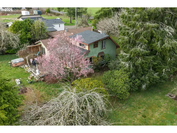 a aerial view of a house with a yard