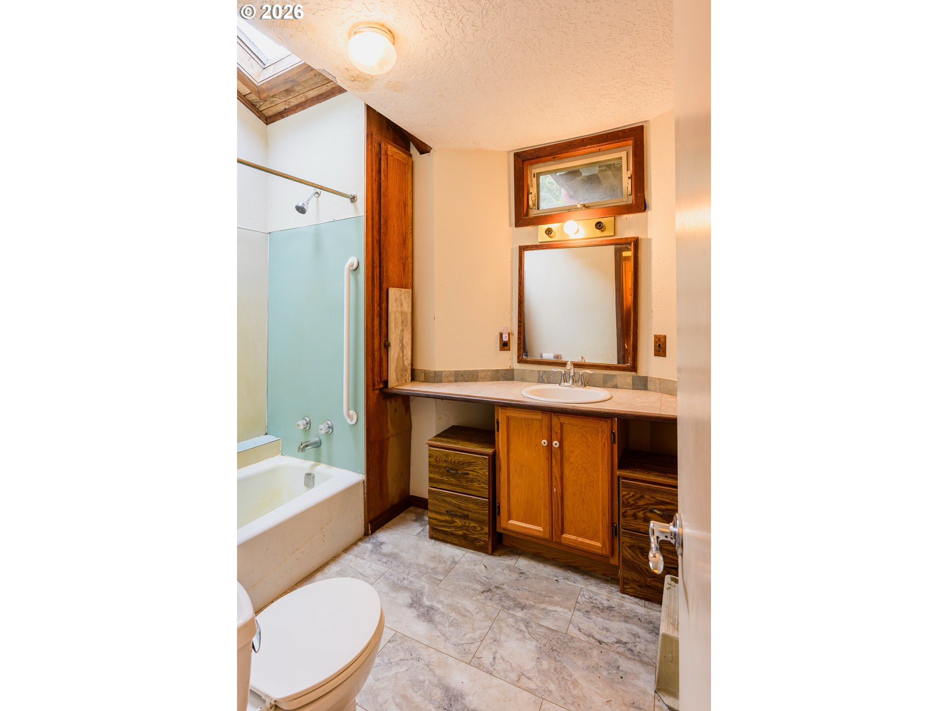 1377 Moonshine Park Road Logsden, OR 97357 - Photo 27 of 40 a bathroom with a sink a mirror and a bathtub
