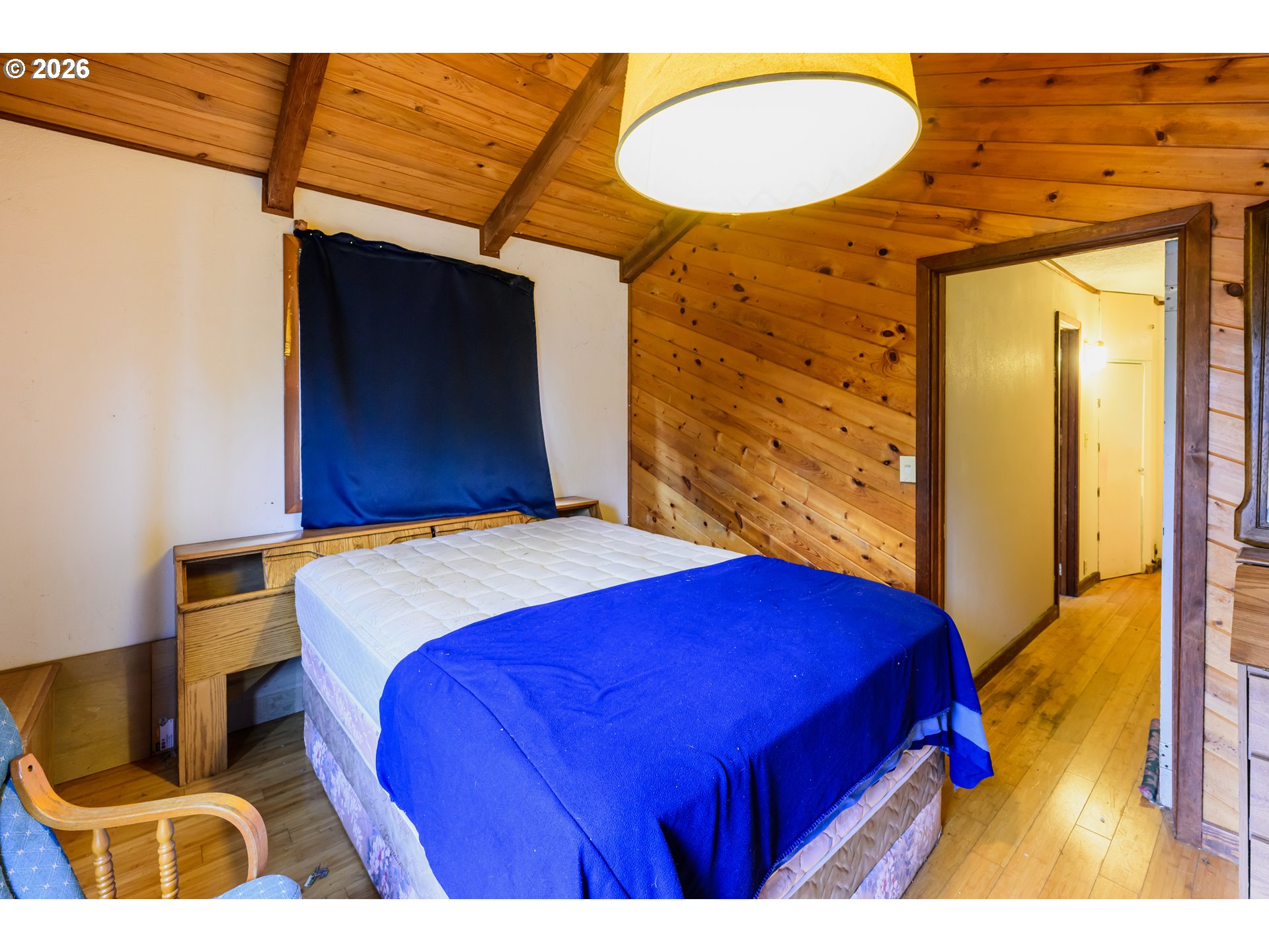 1377 Moonshine Park Road Logsden, OR 97357 - Photo 31 of 40 a bedroom with a bed and a lamp