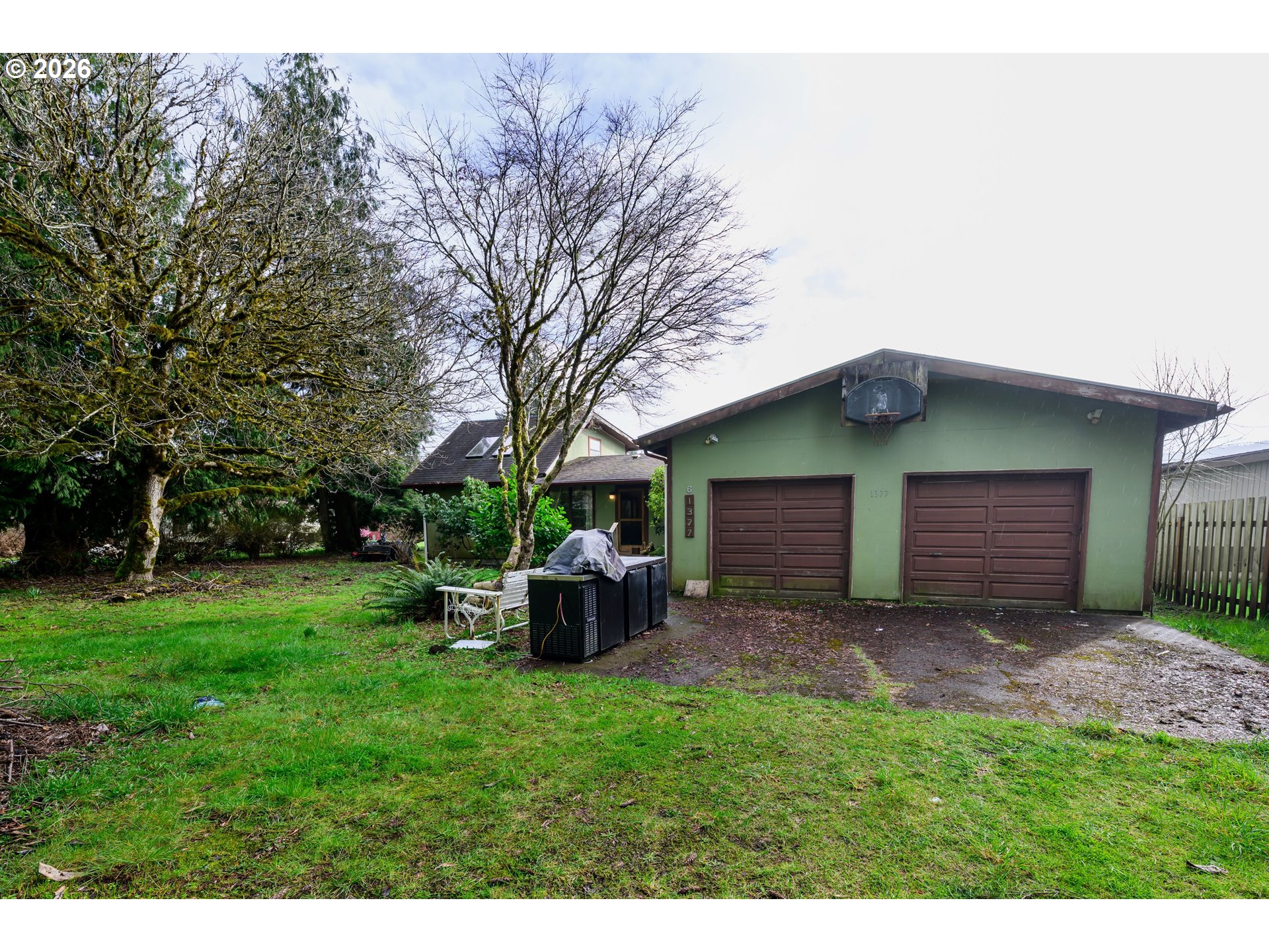 1377 Moonshine Park Road Logsden, OR 97357 - Photo 37 of 40 a backyard of a house with outdoor seating and barbeque oven