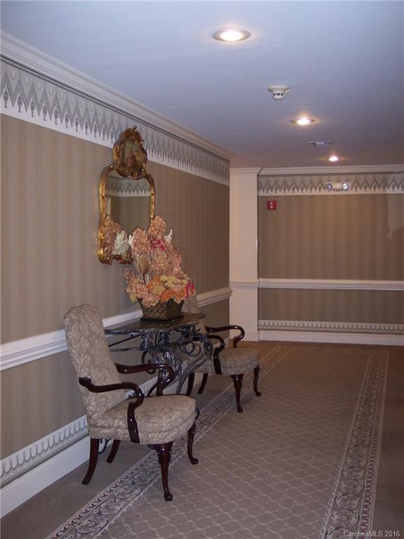 1301 Queens Road, Unit 506 Charlotte, NC 28207 - Photo 6 of 8 a dining room with furniture and window