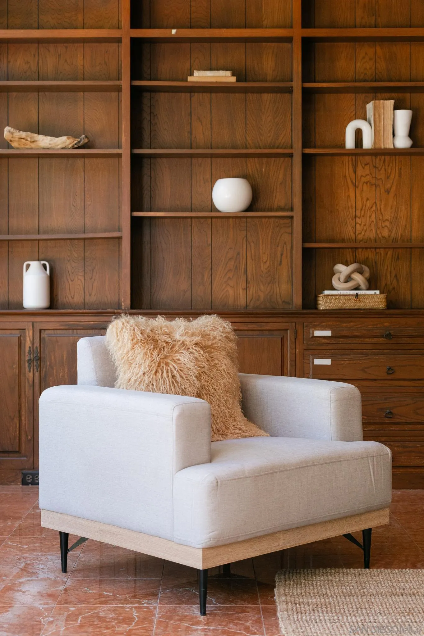 1010 Myrtle Way San Diego, CA 92103 - Photo 12 of 70 a living room with a couch and a shelf