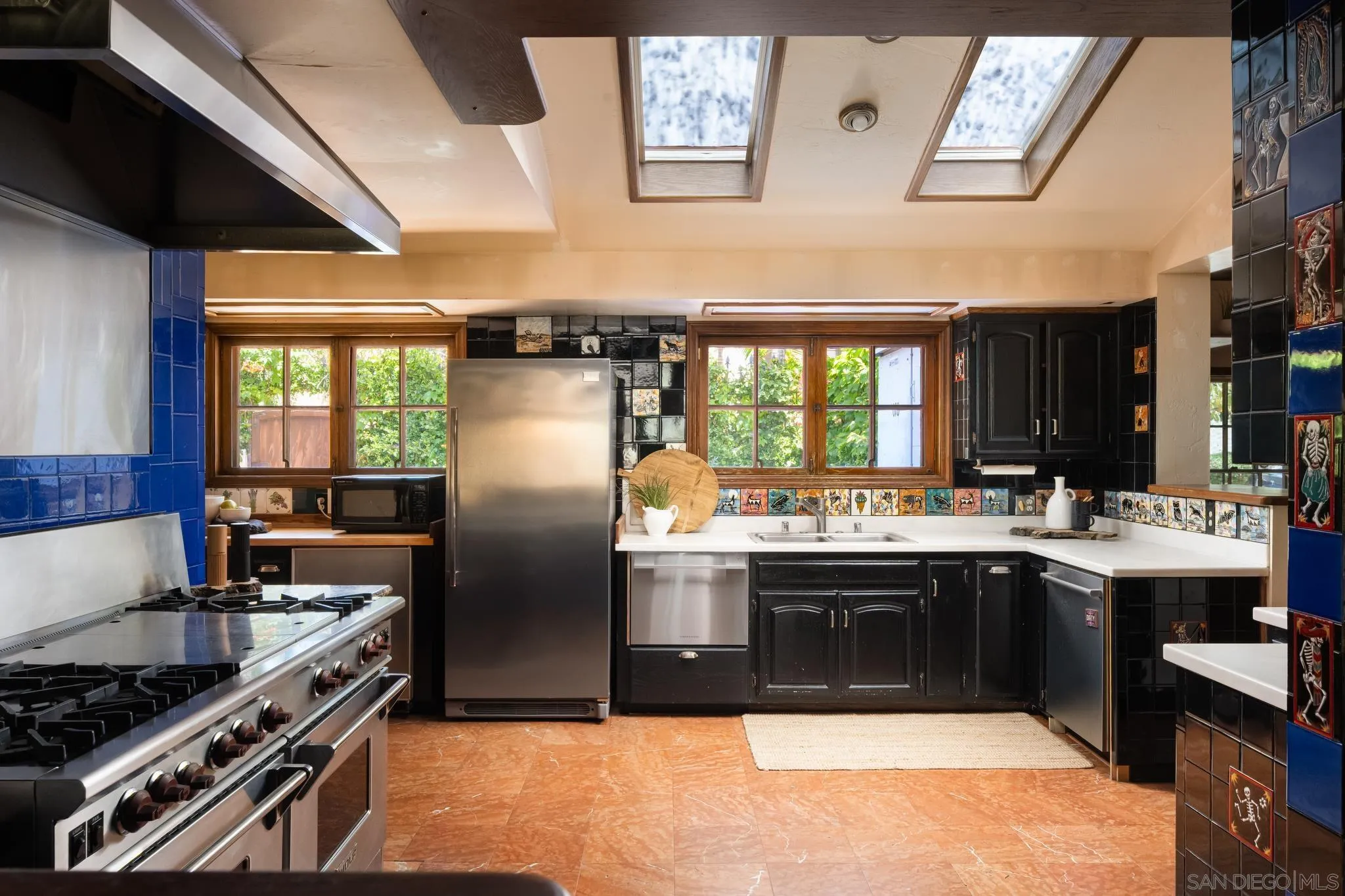 1010 Myrtle Way San Diego, CA 92103 - Photo 16 of 70 a kitchen with stainless steel appliances granite countertop a stove and a sink