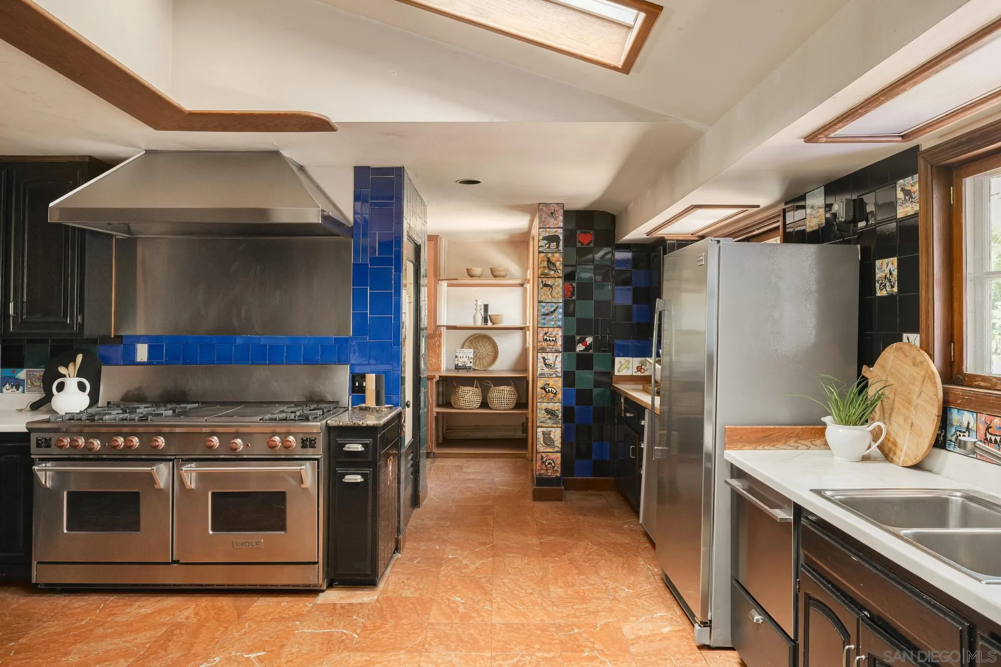 1010 Myrtle Way San Diego, CA 92103 - Photo 17 of 70 a kitchen with a stove and a refrigerator