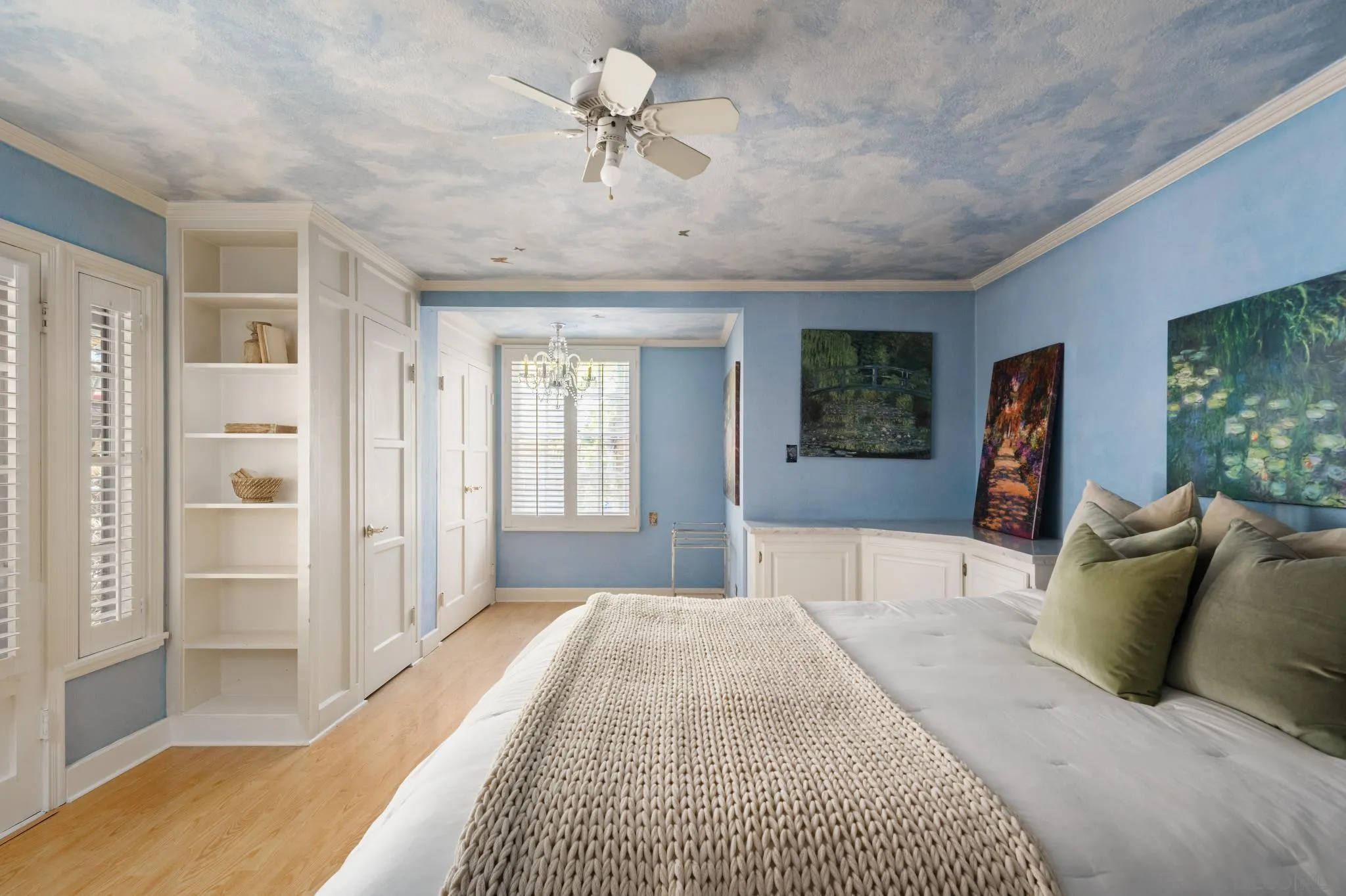 1010 Myrtle Way San Diego, CA 92103 - Photo 33 of 70 a spacious bedroom with a large bed and a chandelier