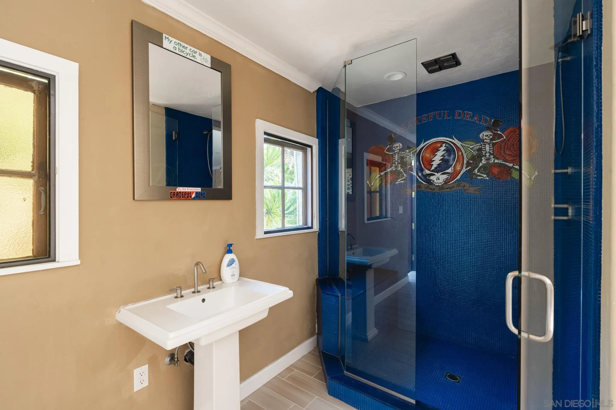 1010 Myrtle Way San Diego, CA 92103 - Photo 65 of 70 a bathroom with a sink and a mirror