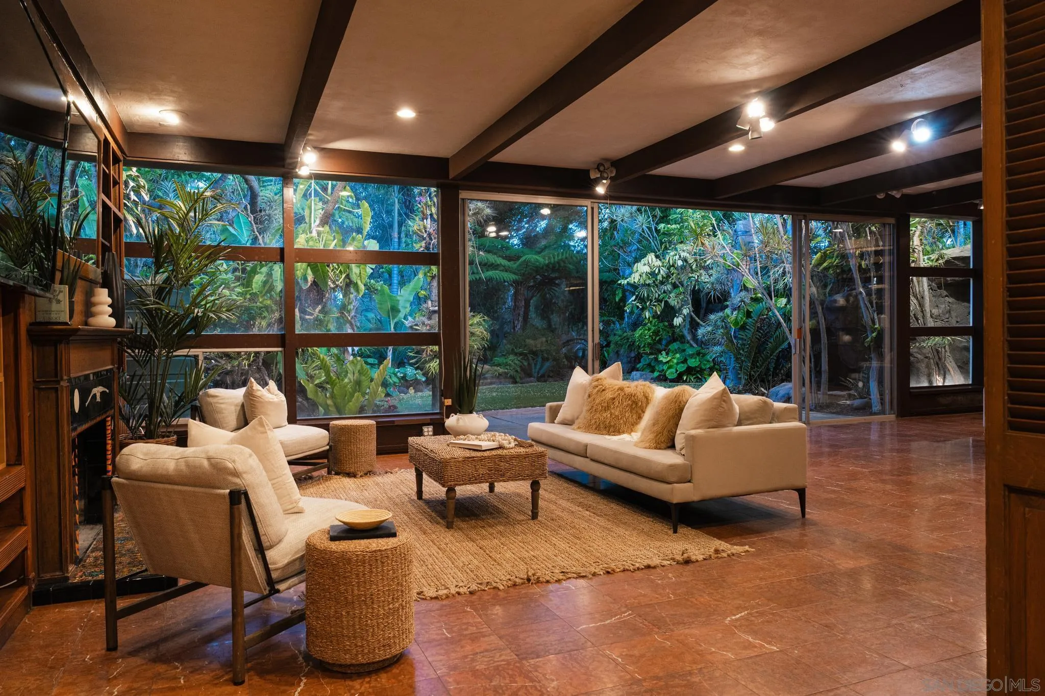 1010 Myrtle Way San Diego, CA 92103 - Photo 7 of 70 a living room with patio furniture and a garden