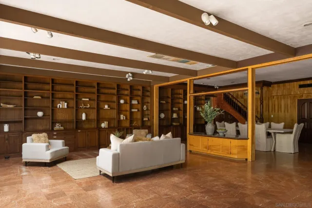 a living room with furniture and white walls