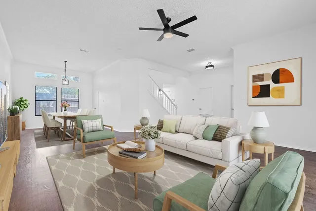 a living room with furniture and a rug