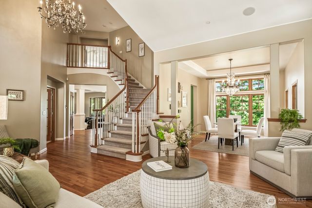 a living room with fireplace furniture and a large window
