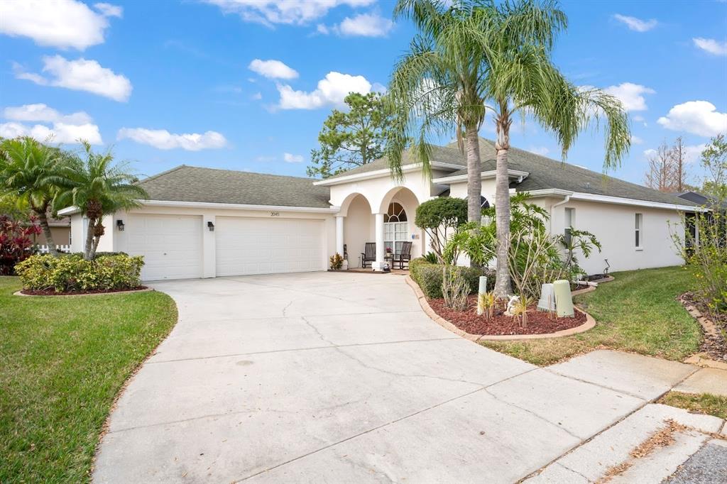 2045 Meadow Rue Court Trinity, FL 34655 - Photo 1 of 1 a front view of a house with a garden
