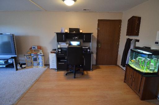 10643 Major Avenue, Unit 3D Chicago Ridge, IL 60415 - Photo 4 of 8 a room with furniture and a flat screen tv