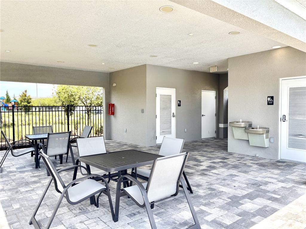 921 Spring Palms Loop Orlando, FL 32828 - Photo 13 of 30 a view of a dining room with furniture window and outside view