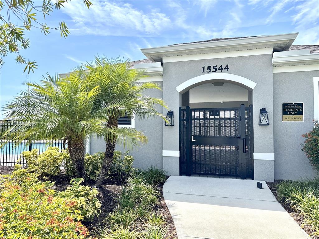 921 Spring Palms Loop Orlando, FL 32828 - Photo 18 of 30 a front view of a house with plants