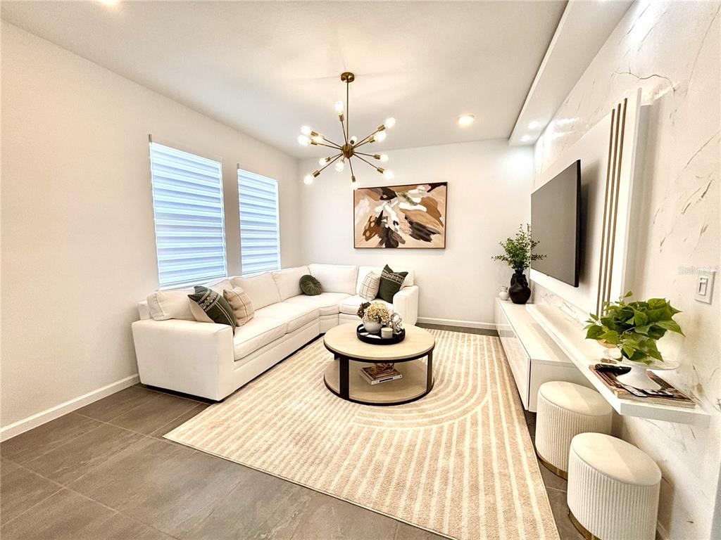 921 Spring Palms Loop Orlando, FL 32828 - Photo 6 of 30 a living room with furniture and a large window