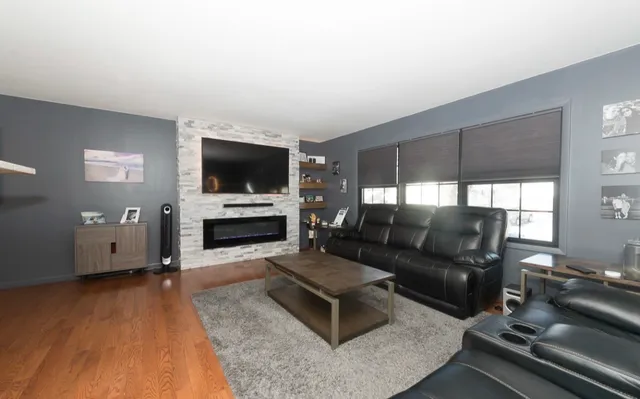 a living room with furniture and a flat screen tv