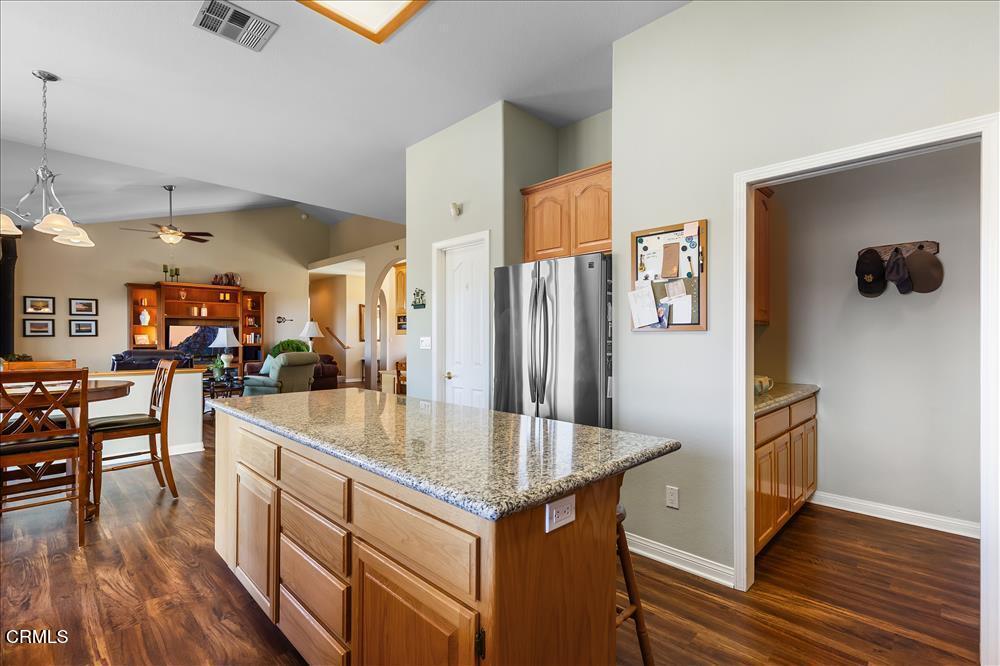 30730 Fox Ridge Court Tehachapi, CA 93561 - Photo 20 of 61 a kitchen with stainless steel appliances granite countertop a refrigerator a stove and a wooden floors