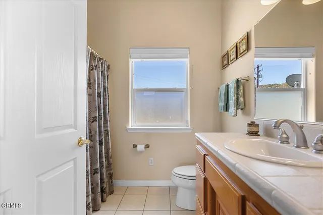 a bathroom with a tub and shower