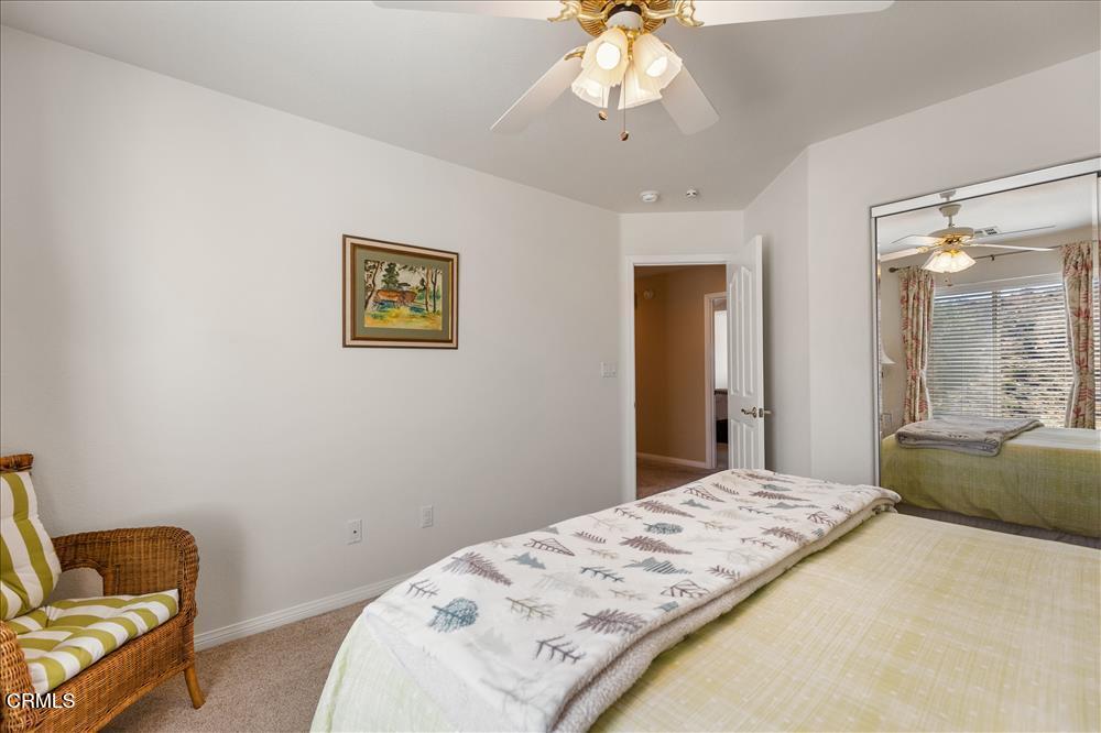 30730 Fox Ridge Court Tehachapi, CA 93561 - Photo 42 of 61 a bedroom with a bed and a chandelier