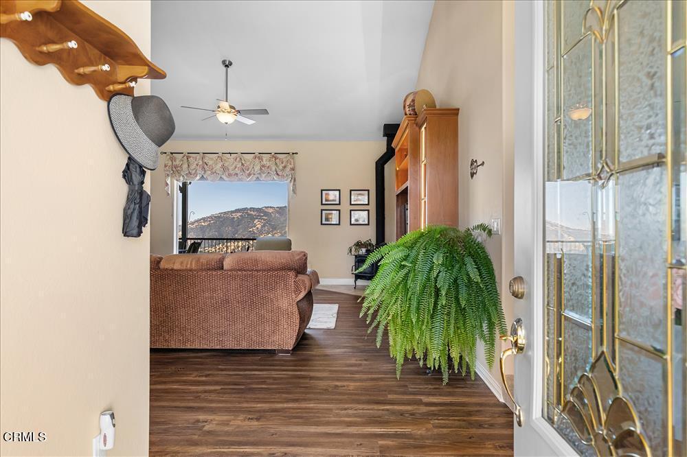 30730 Fox Ridge Court Tehachapi, CA 93561 - Photo 5 of 61 a living room with furniture and a chandelier