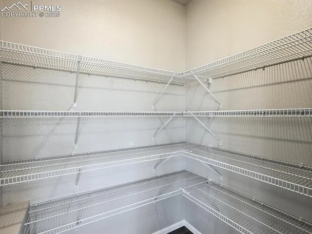 a view of a room with racks on the wall