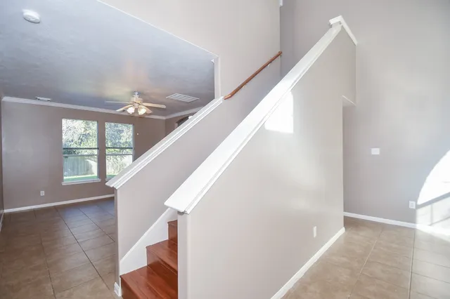 a view of entryway and hall with wooden floor