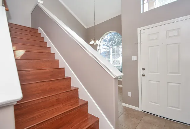 a view of entryway and hall with wooden floor