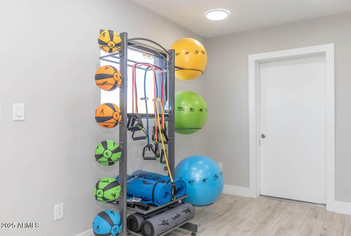 2936 East Indian School Road, Unit 1 Phoenix, AZ 85016 - Photo 10 of 12 a room with toys and wooden floor