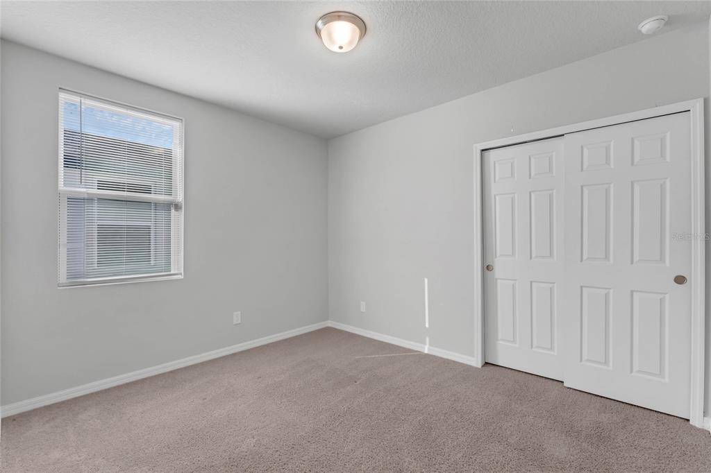 3472 Monaco Drive Davenport, FL 33897 - Photo 18 of 25 a view of an empty room with closet and a window