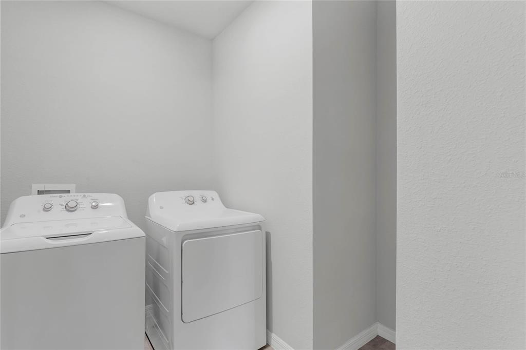 3472 Monaco Drive Davenport, FL 33897 - Photo 21 of 25 a utility room with dryer and washer